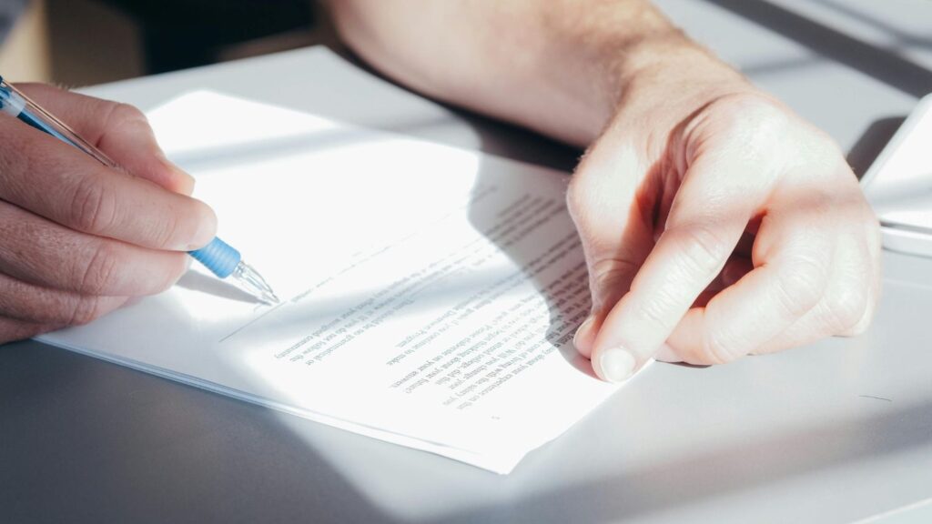 Person signing a contract