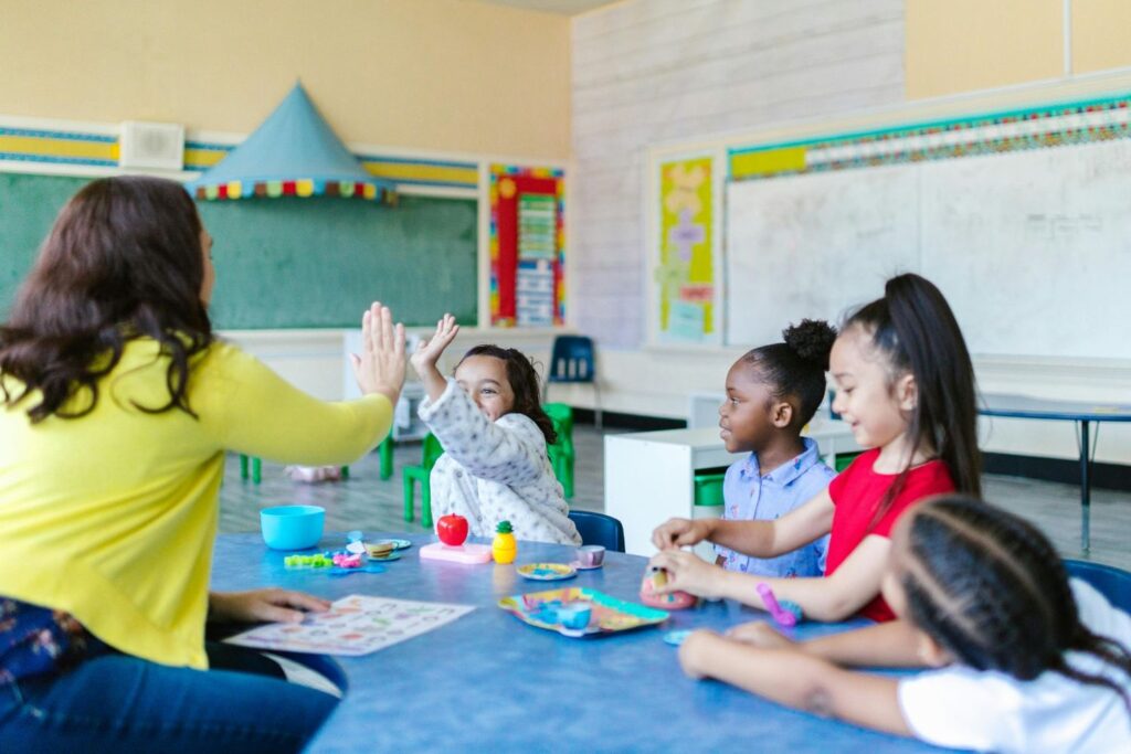 Teacher working with students in an international classroom