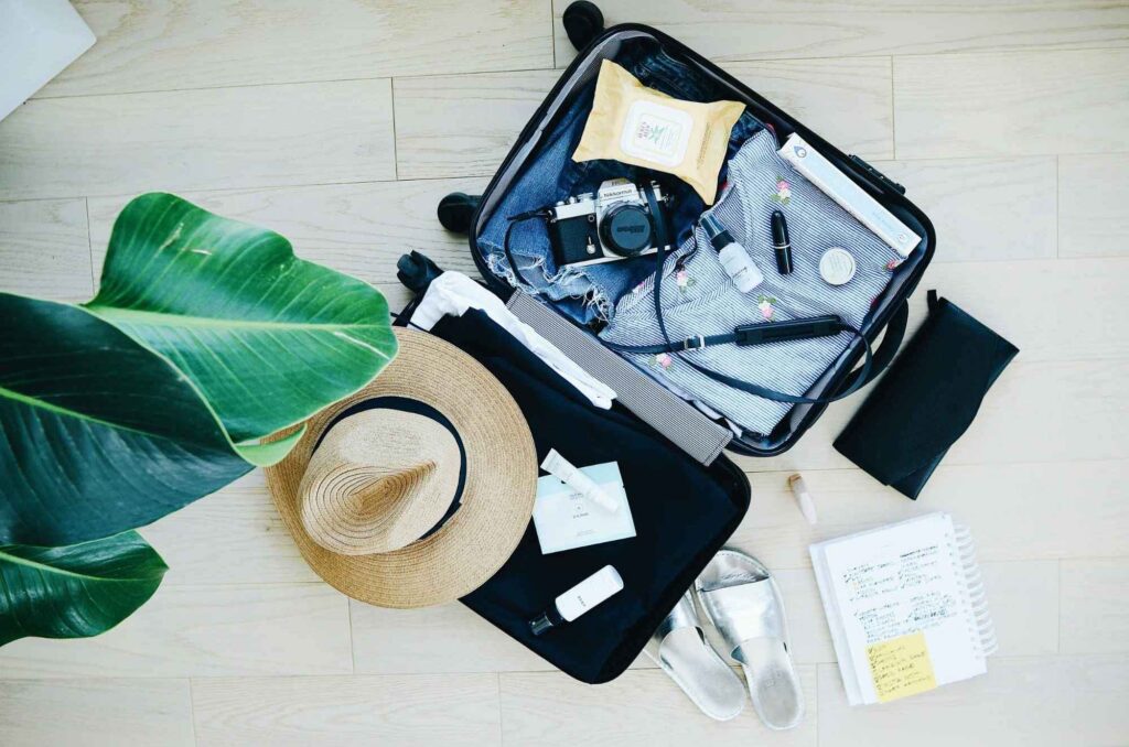 Packing a suitcase before moving abroad for a teaching job.